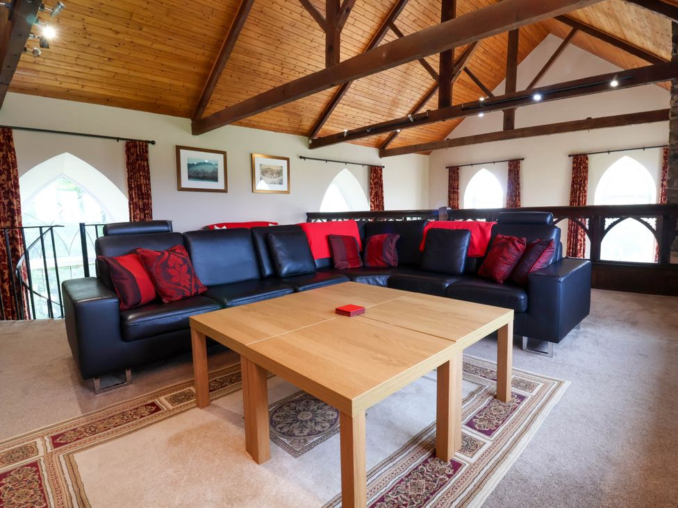 A living room with a sofa and coffee table at Old Chapel in Clovelly