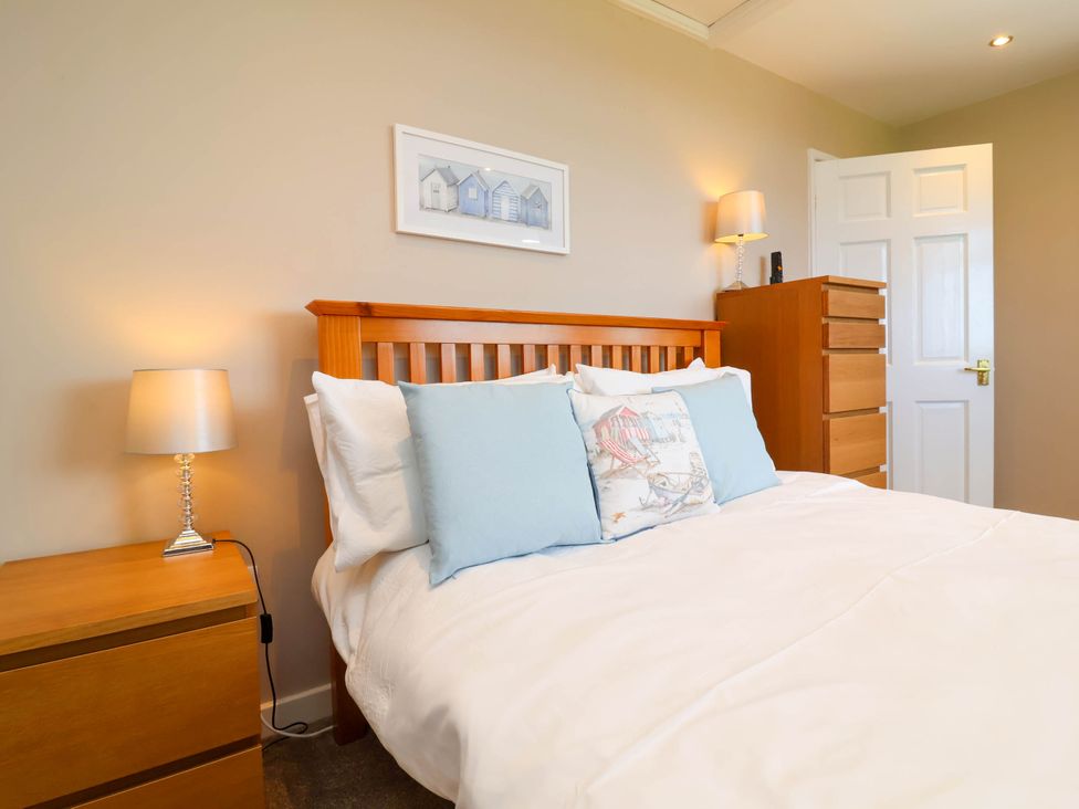 A bedroom with a bed and furniture at Old Chapel in Clovelly