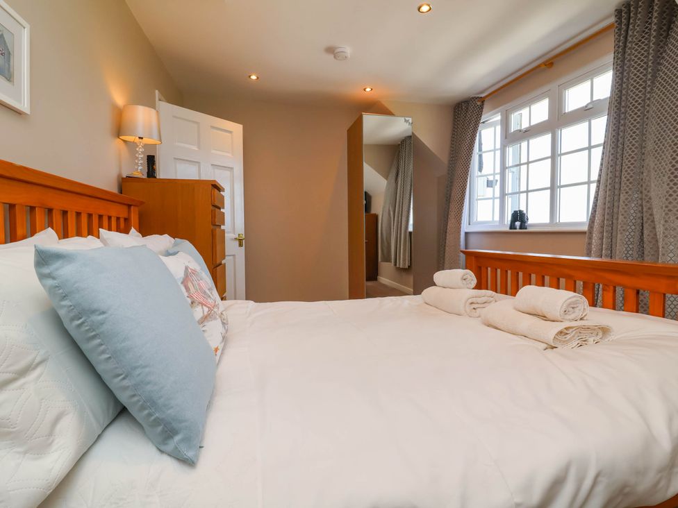 A bedroom with a bed and chest of drawers at Old Chapel in Clovelly