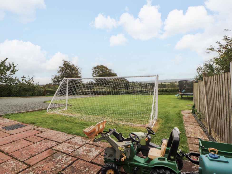 An outdoor area with a goal post and a toy tractor at Stable Cottage in Bolton Low Houses
