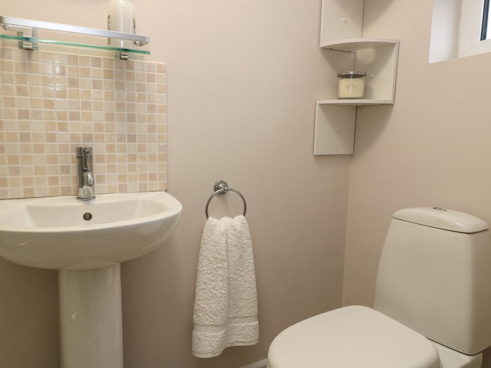 A bathroom with a sink and toilet at Garden Cottage, Rode Farm in Rode