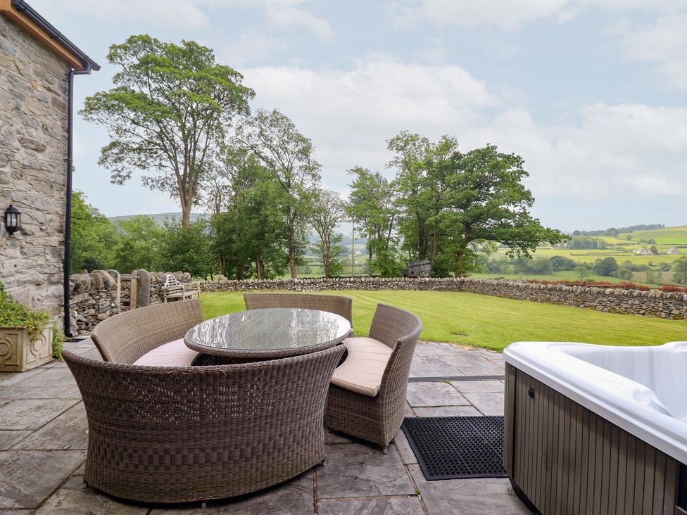 An outdoor area with a table and chairs at Ty Gwyn Llangwm near Bala