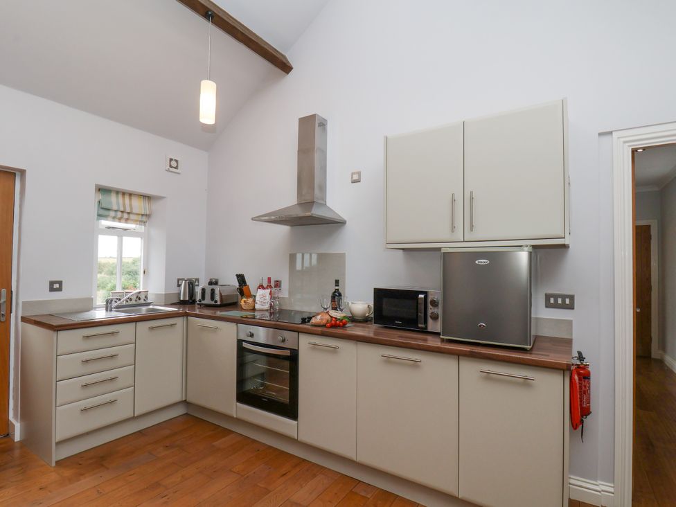 A kitchen with cabinets and appliances at Beacon in Gerrick near Moorsholm