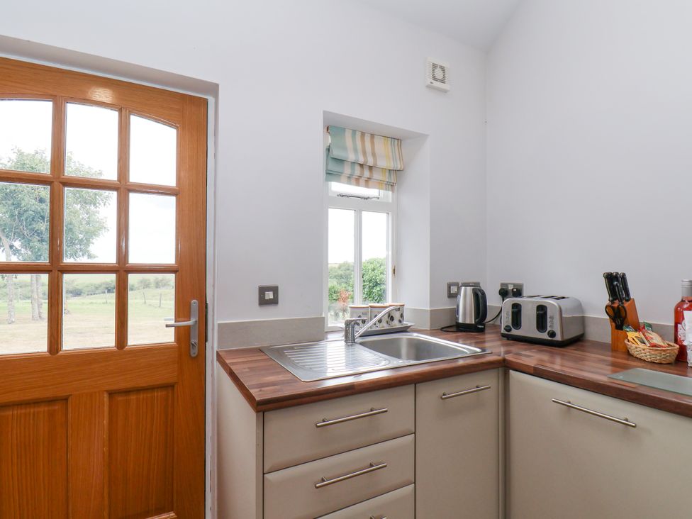 A kitchen with a sink, kettle, and toaster at Beacon in Gerrick near Moorsholm