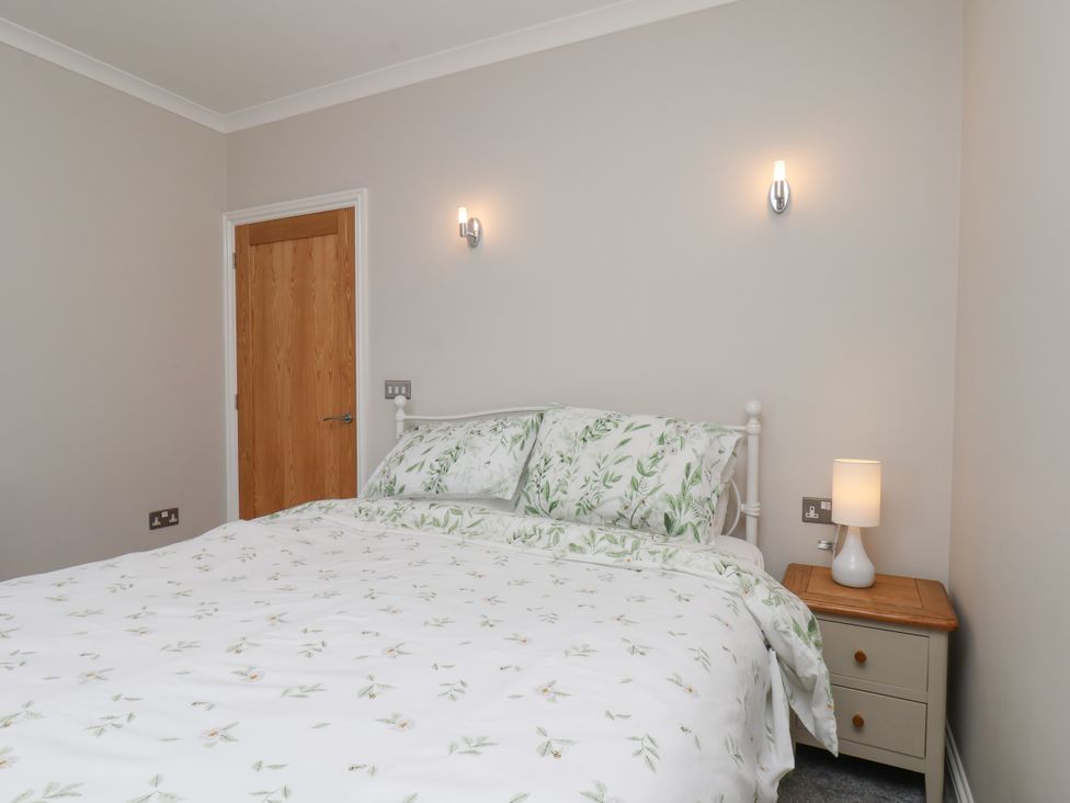 A bedroom with a bed and bedside table at Beacon in Gerrick near Moorsholm