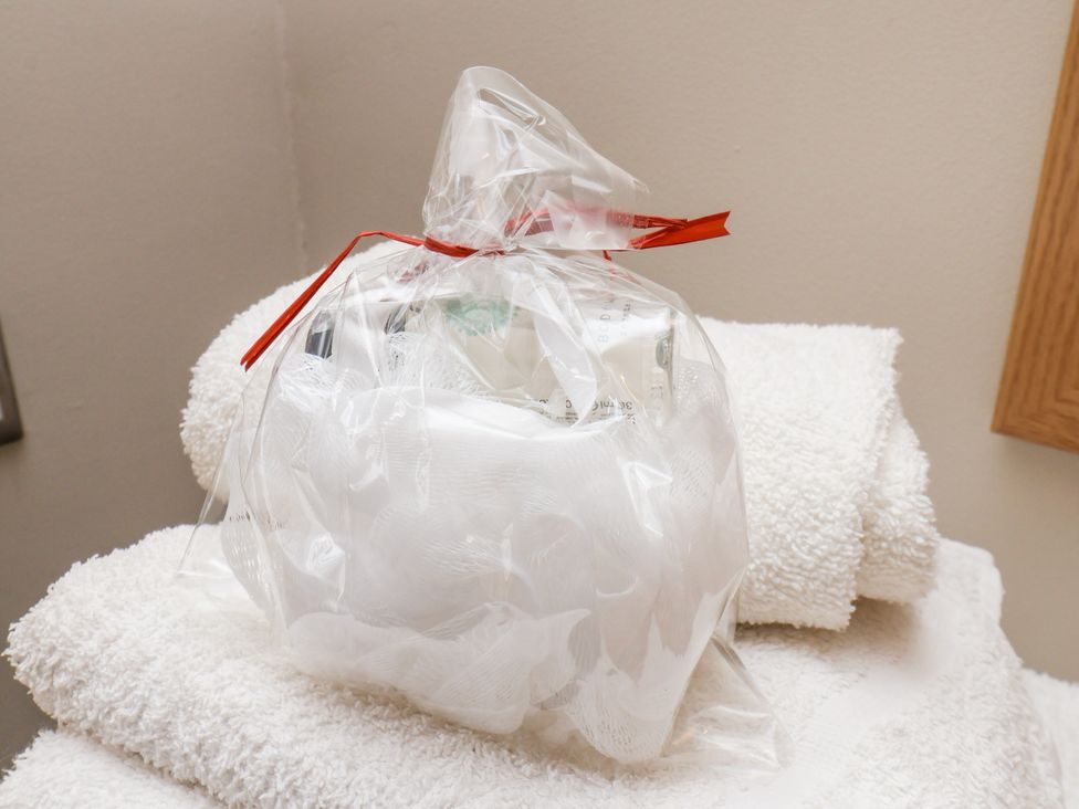 A wrapped gift with toiletries on towels at Beacon in Gerrick near Moorsholm