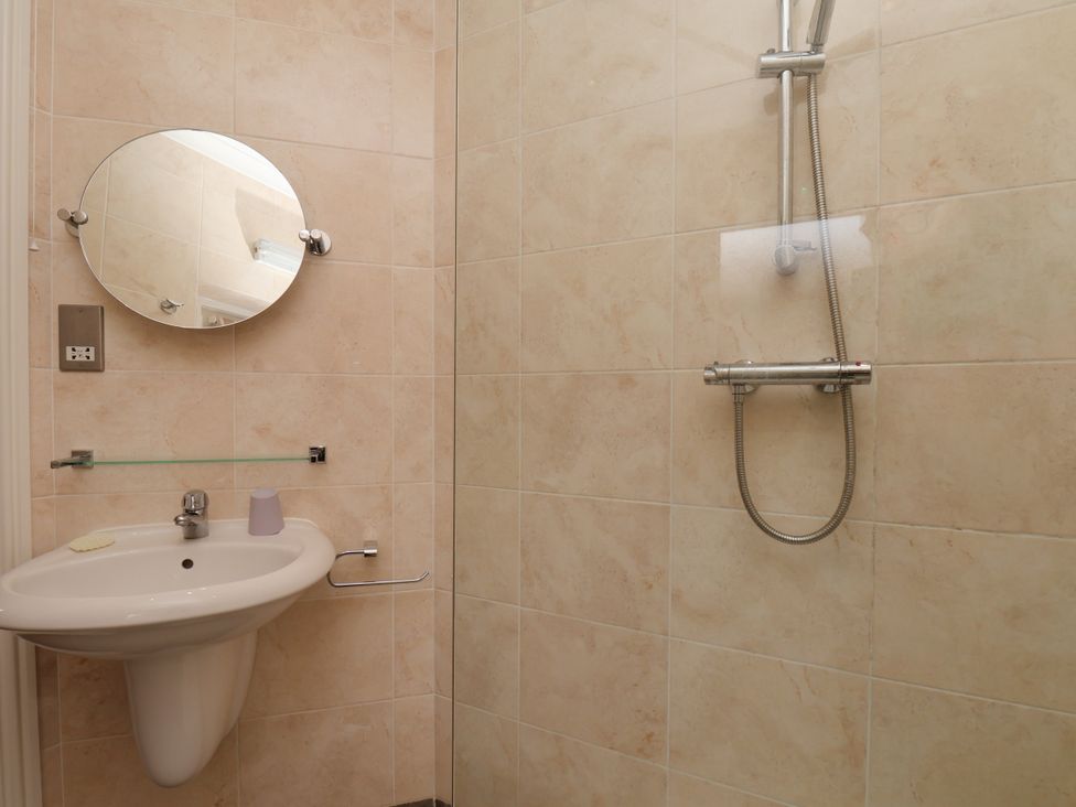 A bathroom with a sink and shower at Beacon in Gerrick near Moorsholm