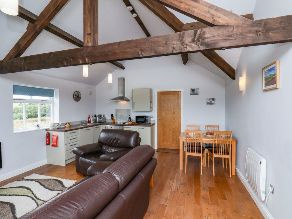 A living room with a kitchen and dining area at Freeborough in Gerrick near Moorsholm