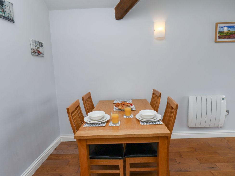A dining room with a table set for breakfast at Freeborough in Gerrick near Moorsholm
