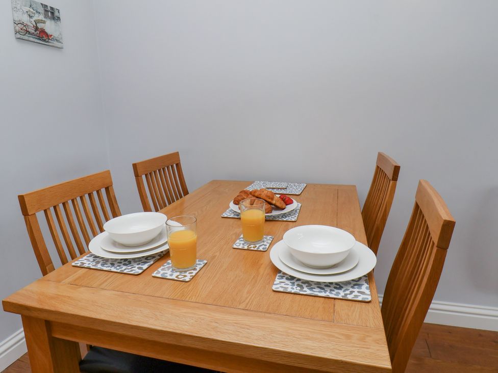 A dining room with a table set for breakfast at Freeborough in Gerrick near Moorsholm