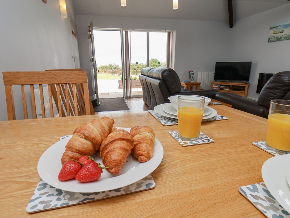 A dining table with food and drinks at Freeborough in Gerrick near Moorsholm
