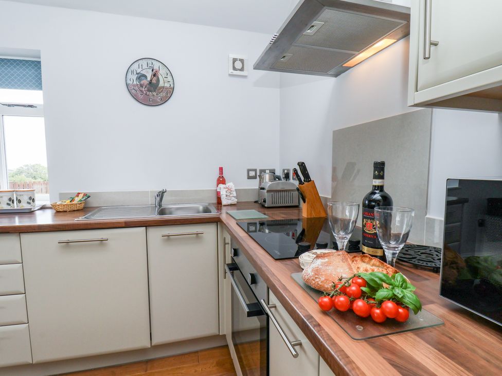 A kitchen with a sink, oven and countertop at Freeborough in Gerrick near Moorsholm