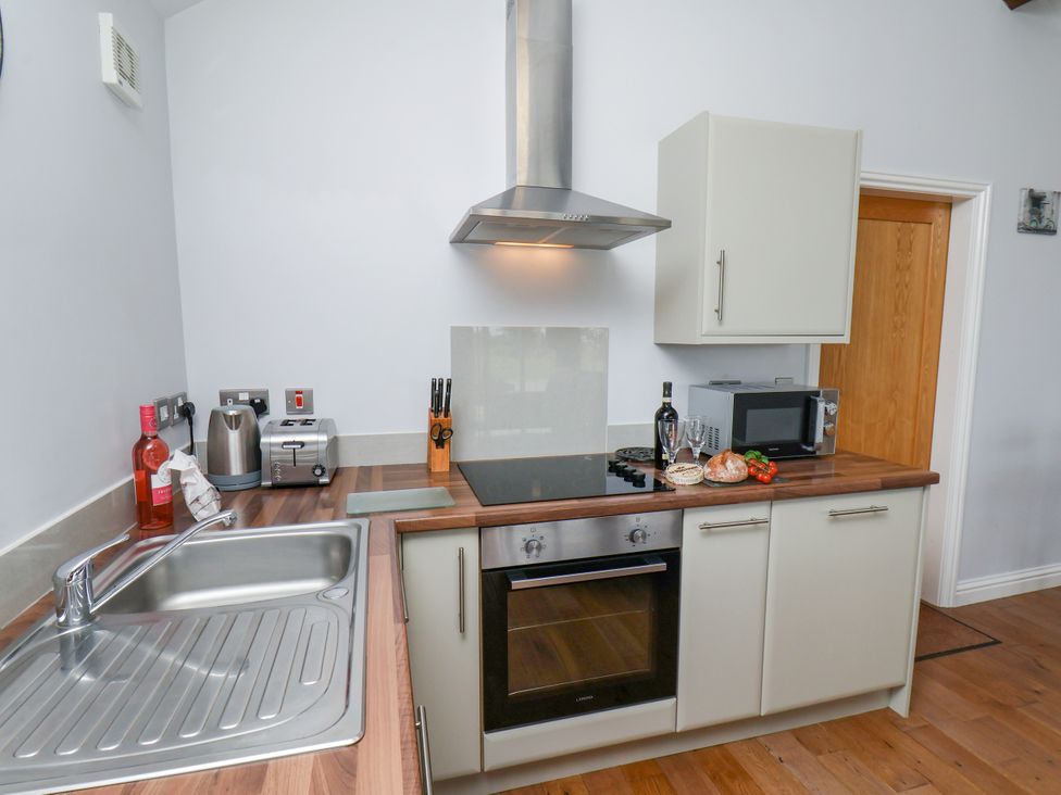 A kitchen with appliances and food items at Freeborough in Gerrick near Moorsholm