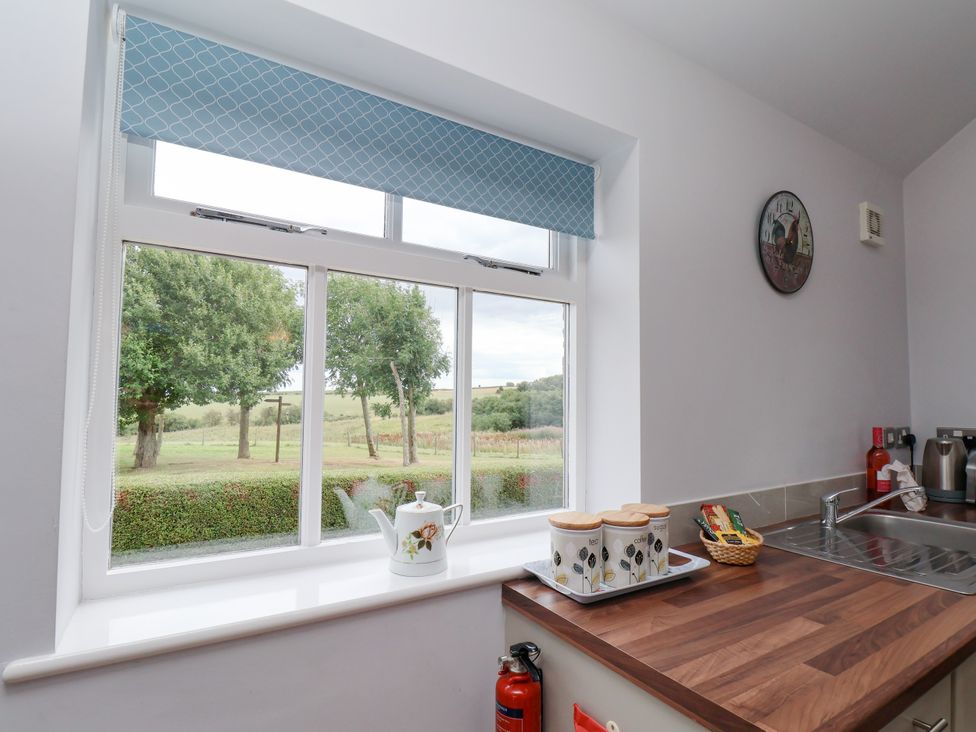 A kitchen with a window and kettle at Freeborough in Gerrick near Moorsholm