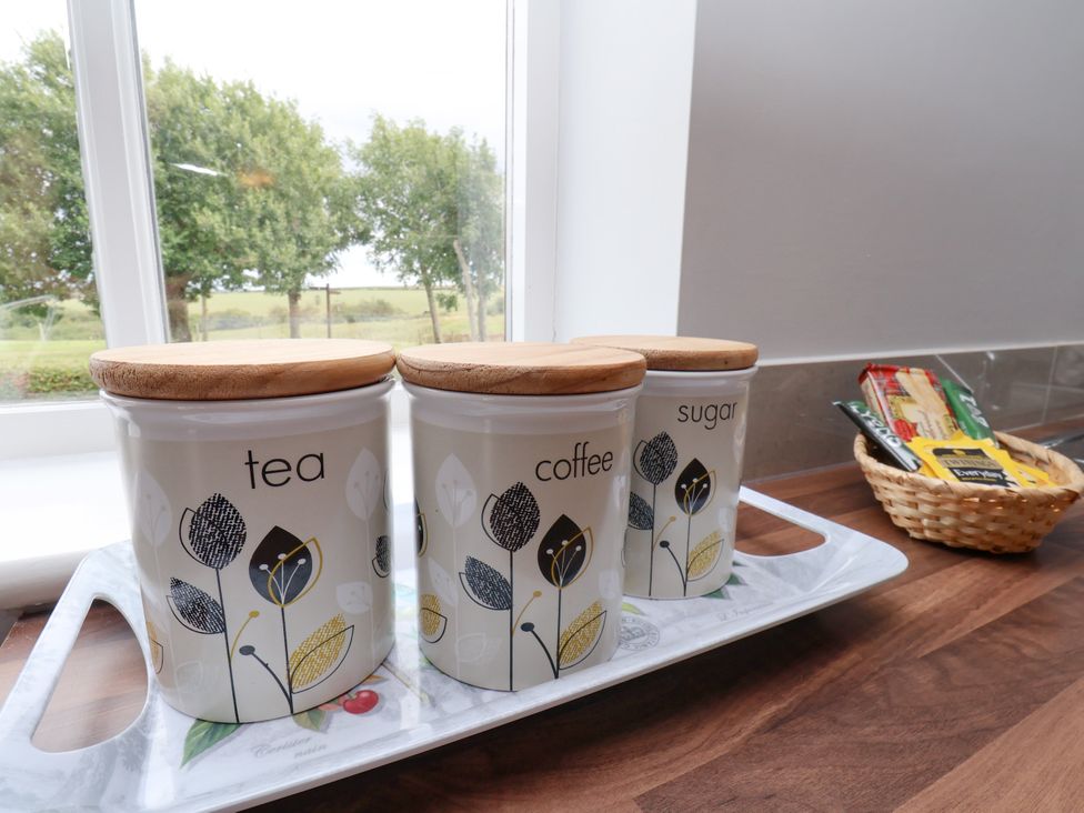 Tea coffee and sugar canisters on a tray in a kitchen at Freeborough, Gerrick near Moorsholm