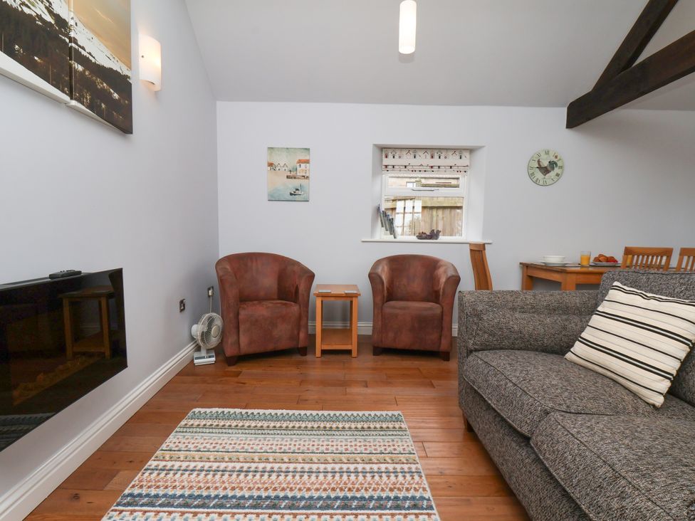 A living room with armchairs and a sofa at Blakey Gerrick near Moorsholm
