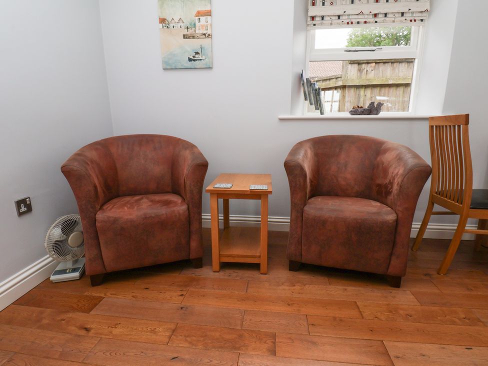 Two armchairs and a coffee table in a sitting room at Blakey Gerrick near Moorsholm