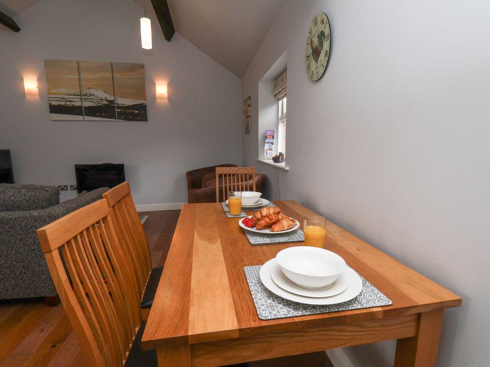 A dining table with croissants and drinks at Blakey in Gerrick near Moorsholm