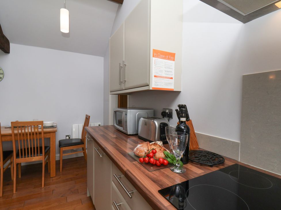 A kitchen with a table and chairs at Blakey Gerrick near Moorsholm