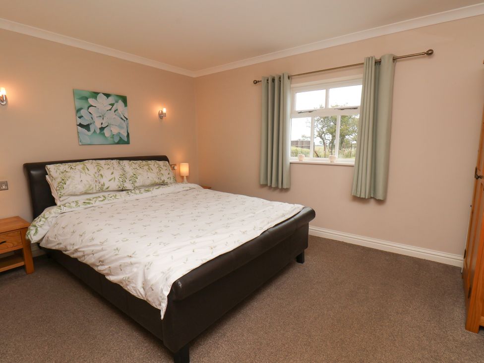 A bedroom with a bed and a window at Blakey in Gerrick near Moorsholm