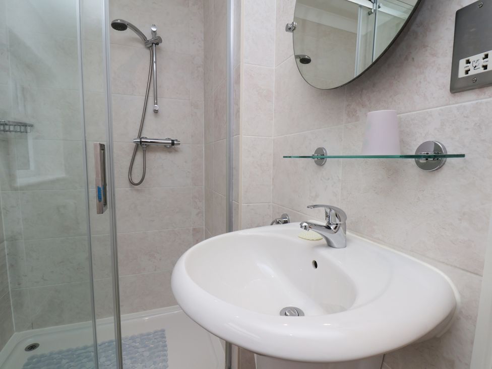 A bathroom with a shower and sink at Blakey Gerrick near Moorsholm