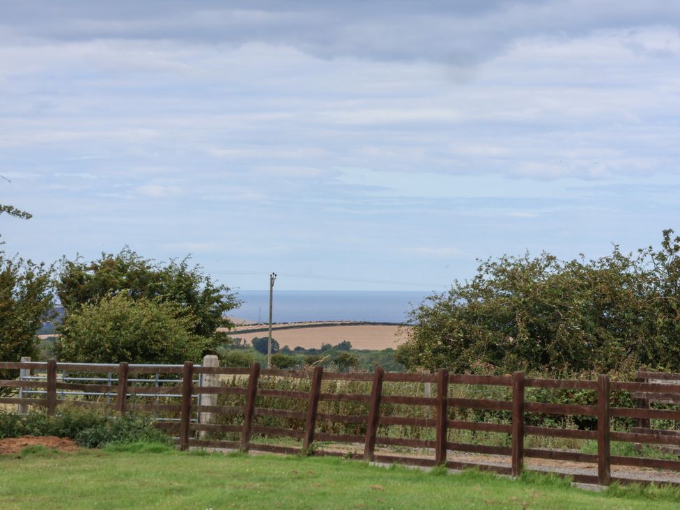 A scenic view with a fence and trees at Blakey in Gerrick near Moorsholm