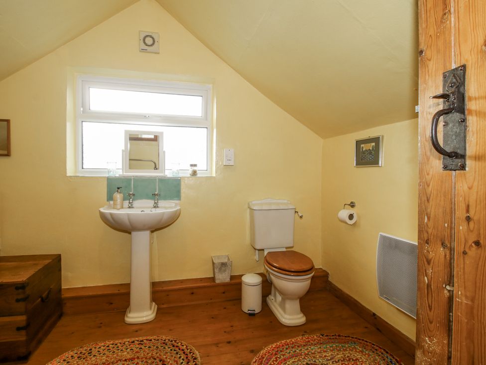 A bathroom with a sink and toilet at Marigold Cottage in Clun near Bishop's Castle