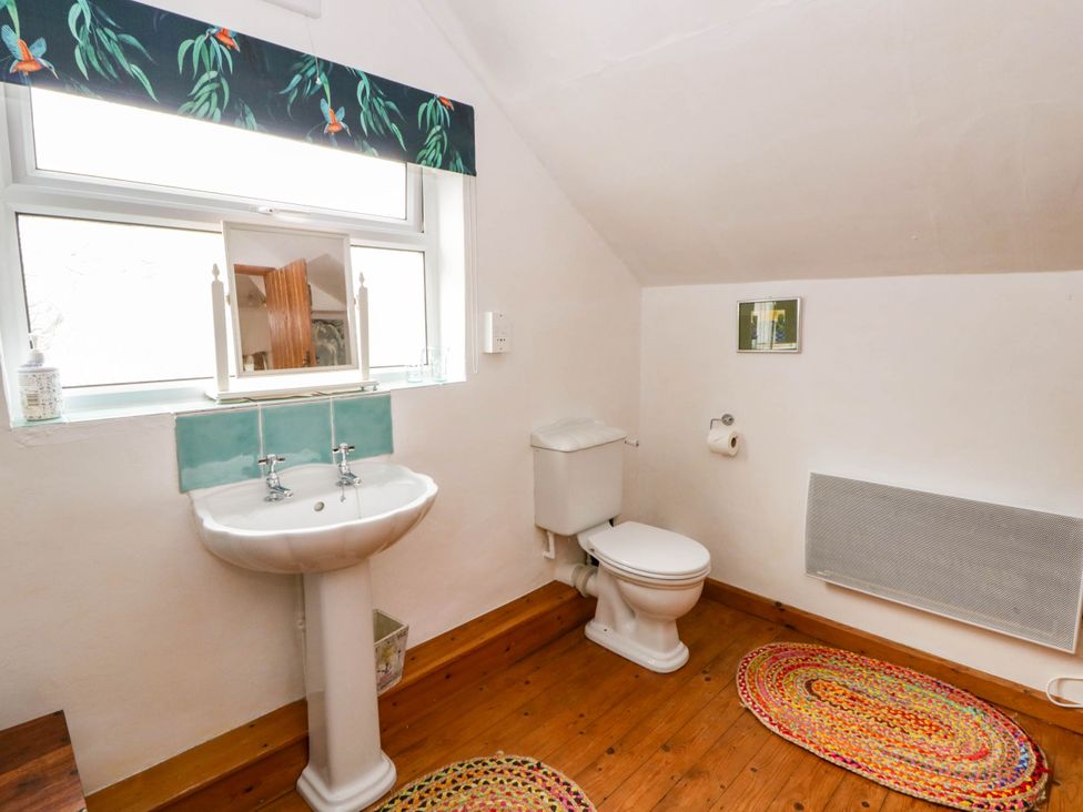 A bathroom with a sink and toilet at Marigold Cottage in Clun near Bishop's Castle