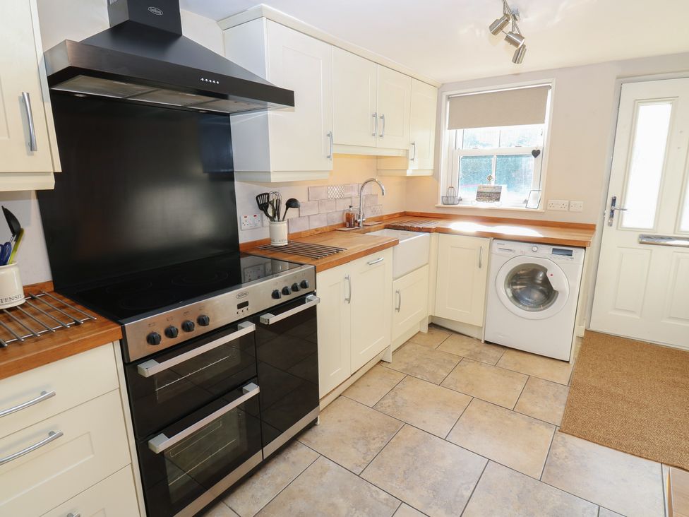 A kitchen with an oven and sink at Hillside View in Hawes