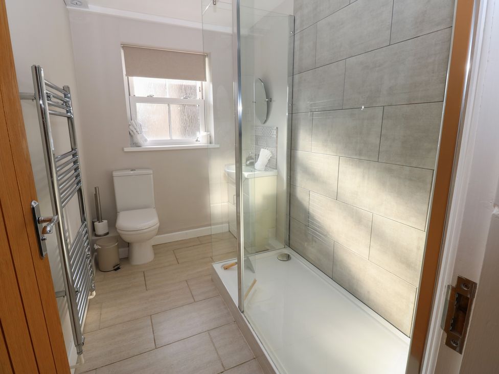 A bathroom with a shower and a toilet at Hillside View in Hawes