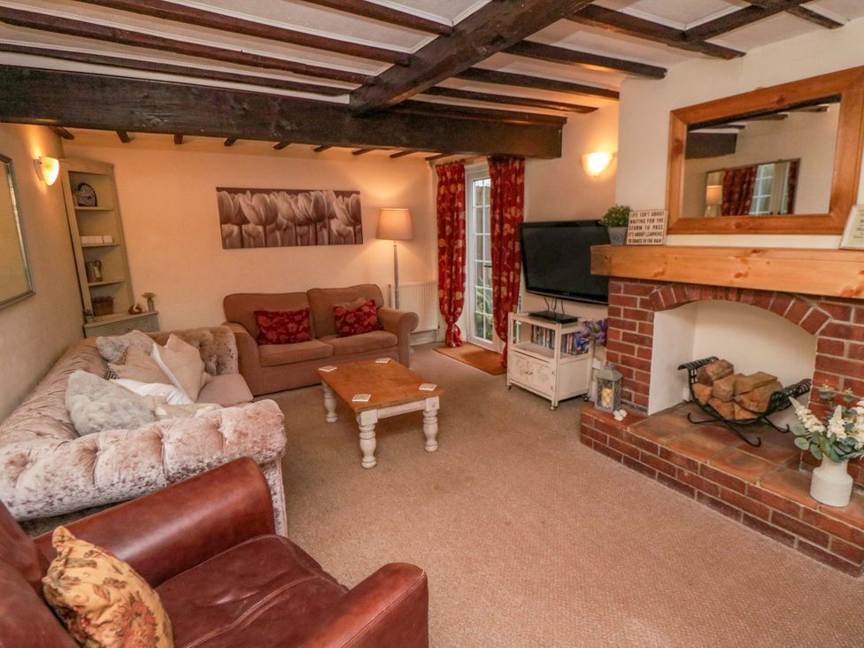 A living room with a sofa and coffee table at Jasmine Cottage Dalton Near Thirsk