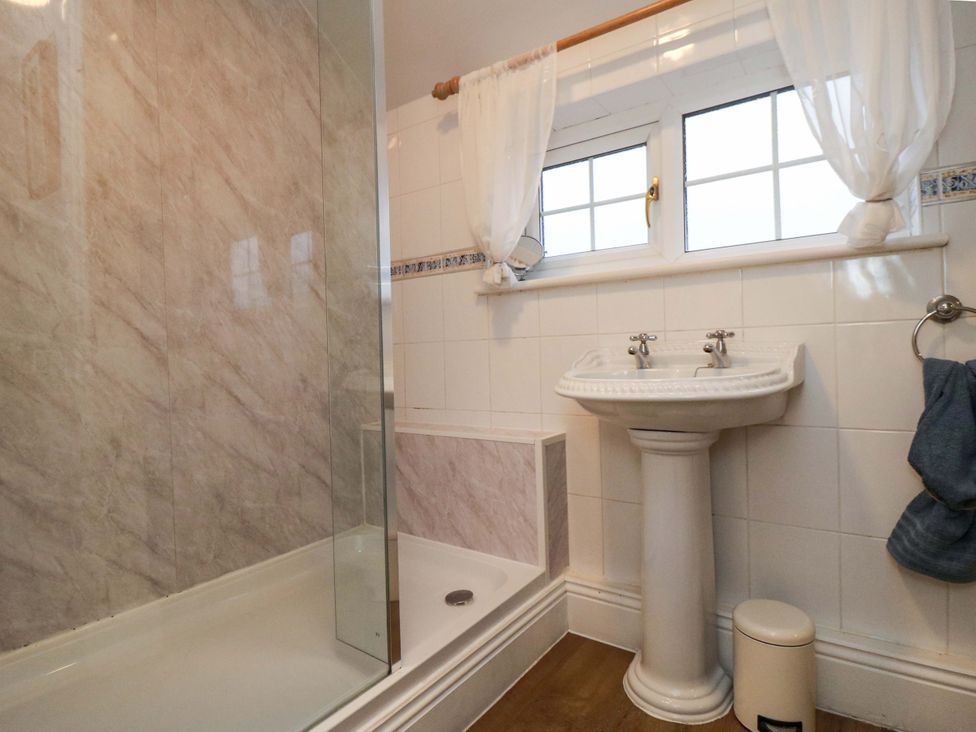 A bathroom with a shower and sink at Jasmine Cottage Dalton Near Thirsk