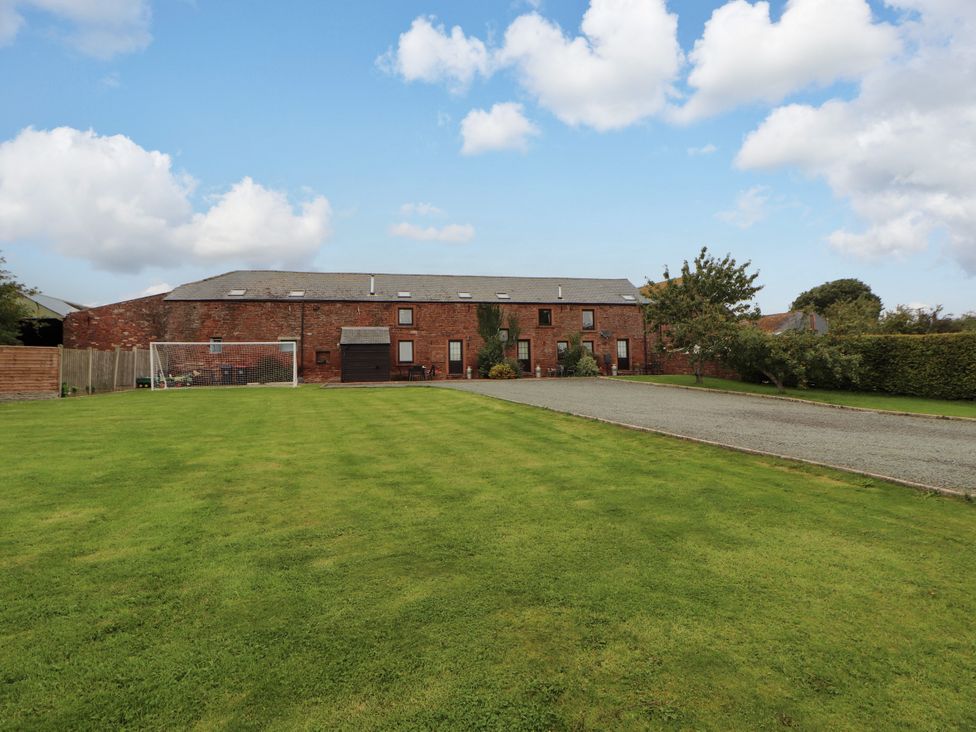 An outdoor area with a building and a goalpost at Hayloft Cottage Bolton Low Houses
