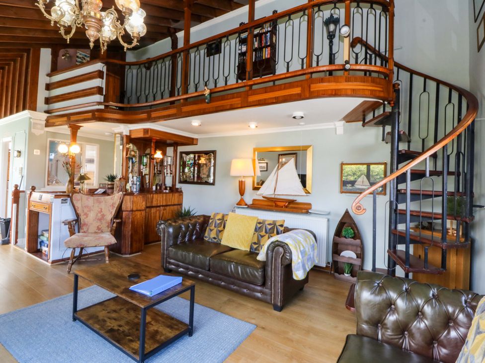 A living room with a sofa and coffee table in Boathouse Deganwy near Llandudno