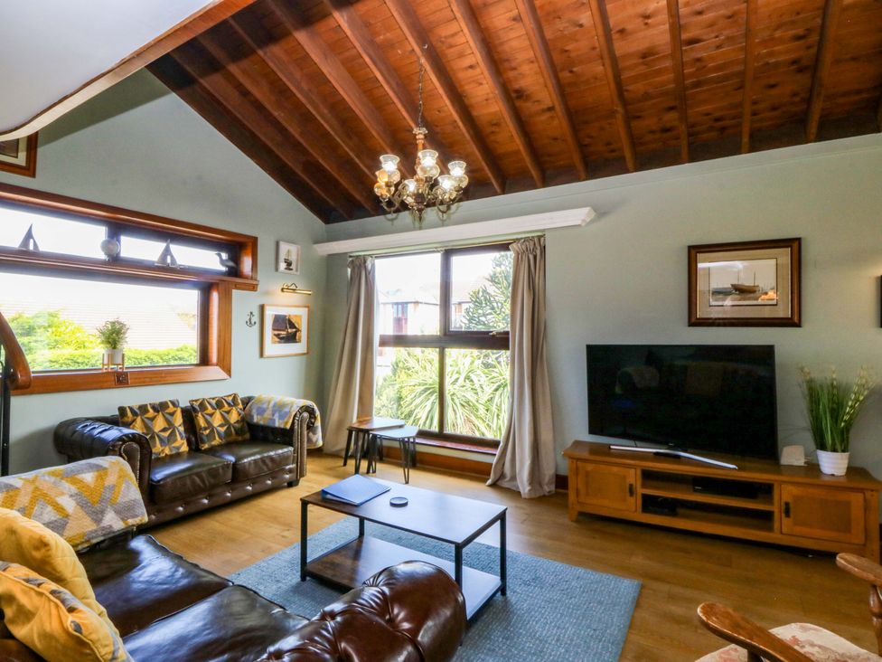 A living room with a sofa and table at Boathouse in Deganwy near Llandudno
