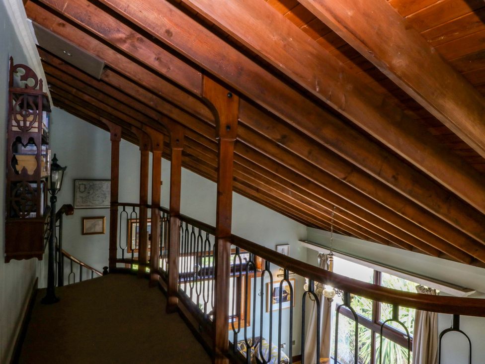 A hallway with wooden beams and a staircase at Boathouse in Deganwy near Llandudno