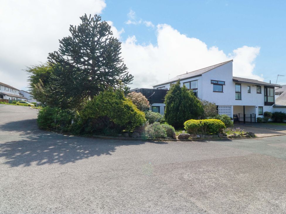 A view of a residential area with trees and houses at Boathouse in Deganwy near Llandudno