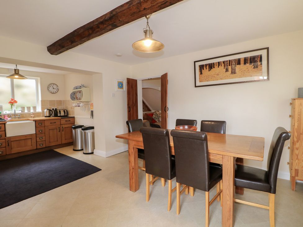 A dining area with a table and chairs at Ash House in Alton near Alton Towers