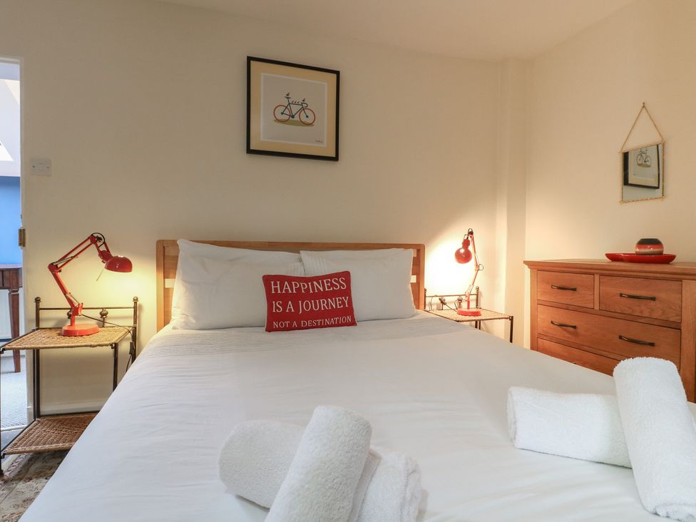 A bedroom with a bed and bedside table at Ash House in Alton near Alton Towers