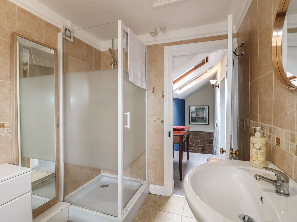 A bathroom with a shower and sink at Ash House in Alton near Alton Towers