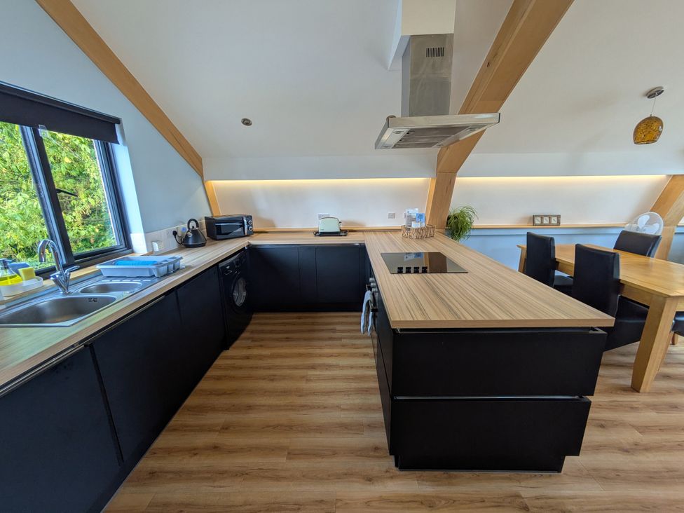 A kitchen with sink and countertop at Cointree in Sturminster Newton
