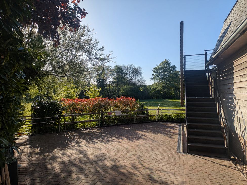 An outdoor area with a staircase and garden at Cointree in Sturminster Newton