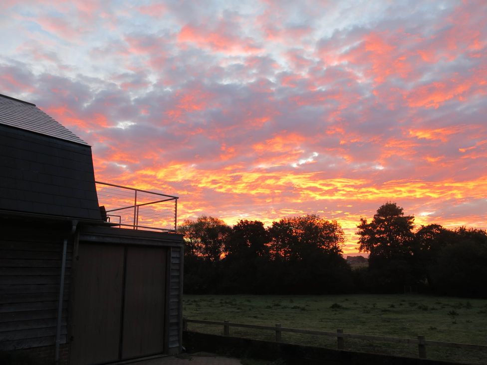 A sunset view with clouds and trees at Cointree in Sturminster Newton