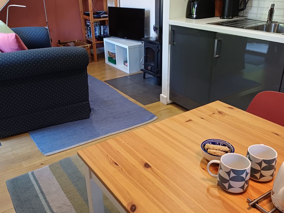 A living room with a sofa and a coffee table at The Sidings in Wirksworth