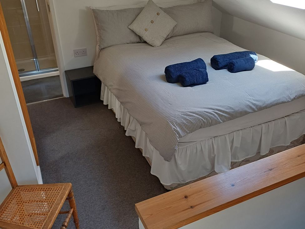 A bedroom with a bed and shower at The Sidings in Wirksworth