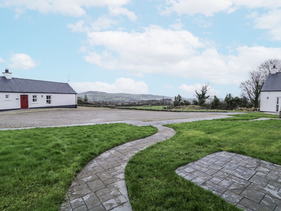 An outdoor area with a house and a pathway at Foyle Cottage near Strabane