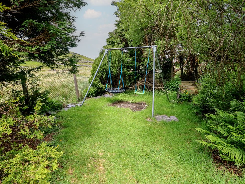 A swing set in a garden at Glan y Gors in Dinorwic near Llanberis