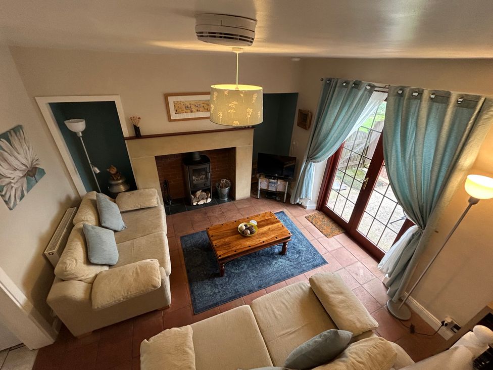 A living room with a sofa and a coffee table at Sea Lily New Haggerston near Holy Island