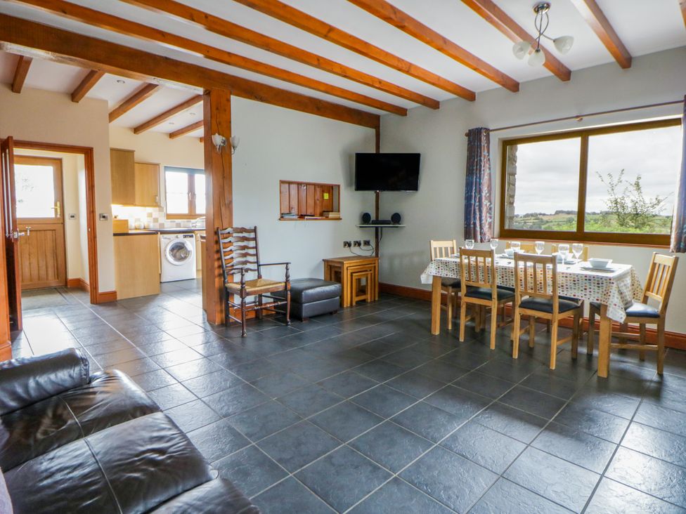 A dining room with a table and chairs at Y Bwthyn Swyddffynnon near Pontrhydfendigaid