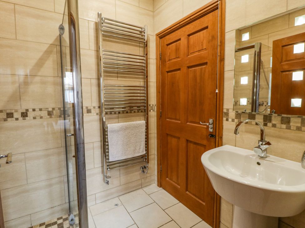 A bathroom with a shower and sink at Y Bwthyn in Swyddffynnon near Pontrhydfendigaid